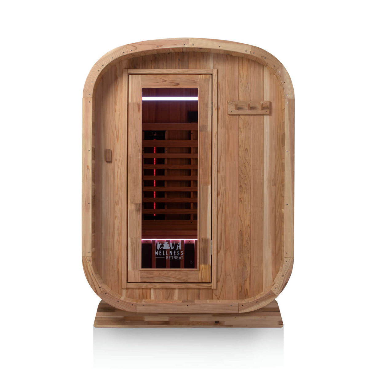 Front view of a rounded Kiva Wellness Retreat outdoor sauna with soft lighting behind its glass door.