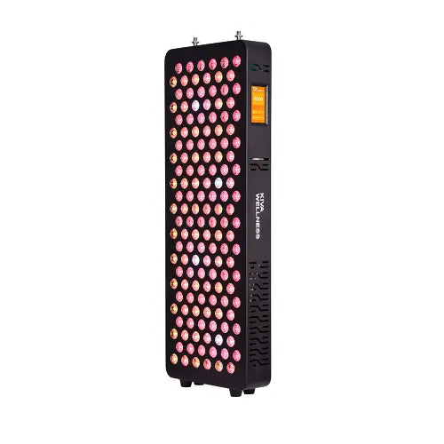 Kiva Wellness Solace Core red light therapy panel with illuminated LEDs and a control screen on the side.