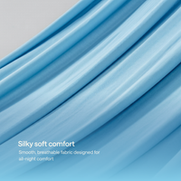 Close-up of draped slate Kiva cooling blanket with soft folds.