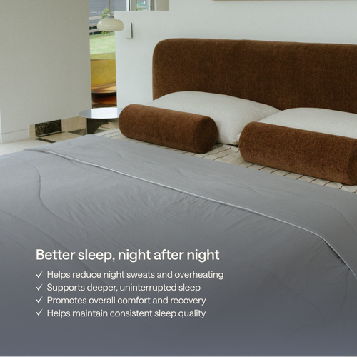 A bed with Kiva cooling blanket, shown in a modern bedroom setting.