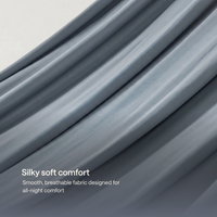 Close-up of draped slate Kiva cooling blanket with soft folds.