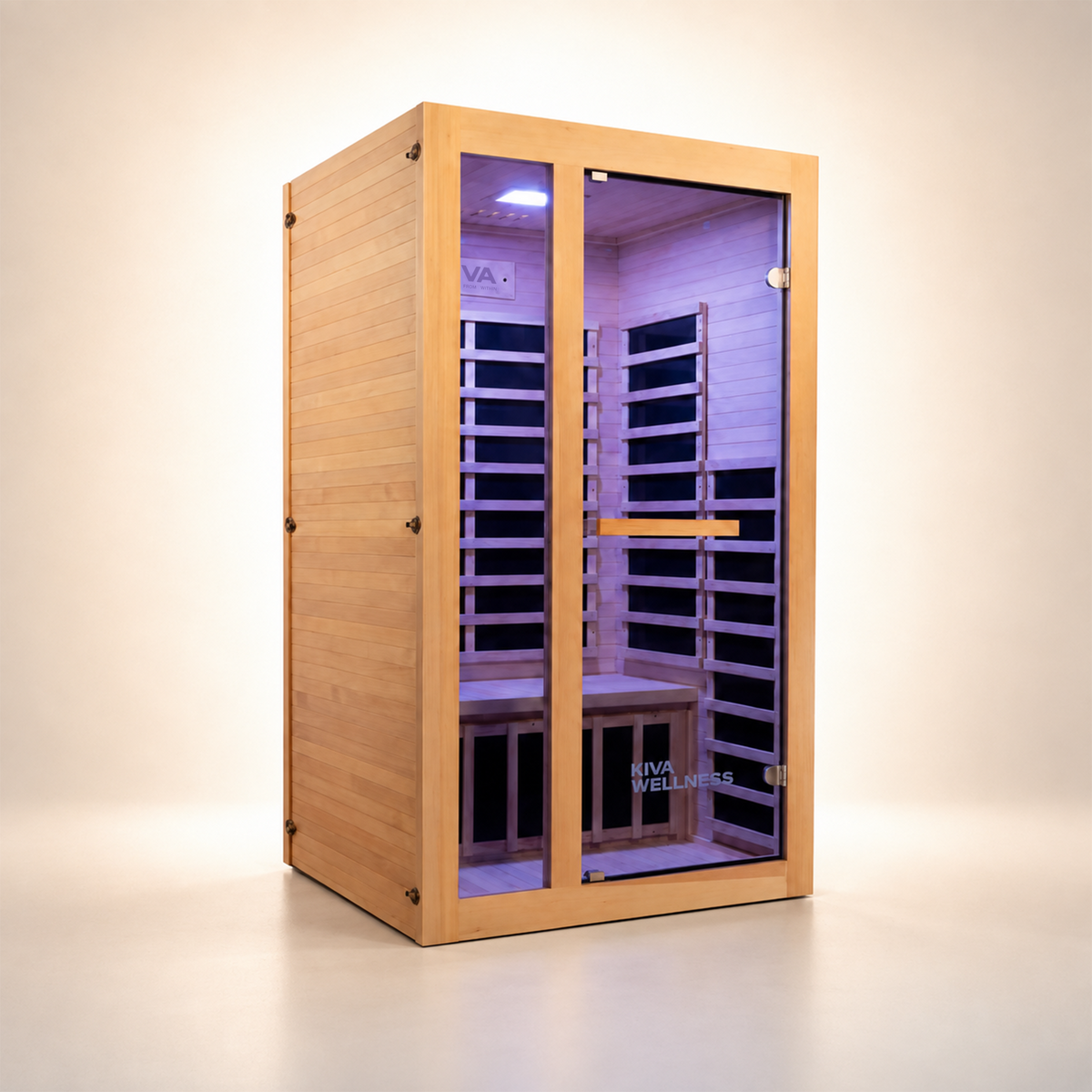 A Kiva Wellness infrared sauna with glass door, interior lighting, and seating bench, on a clean beige studio background.