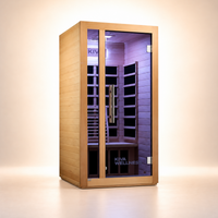 A Kiva Wellness infrared sauna with a light wood exterior, glass door, and a purple-lit interior, shown on a clean beige studio background.