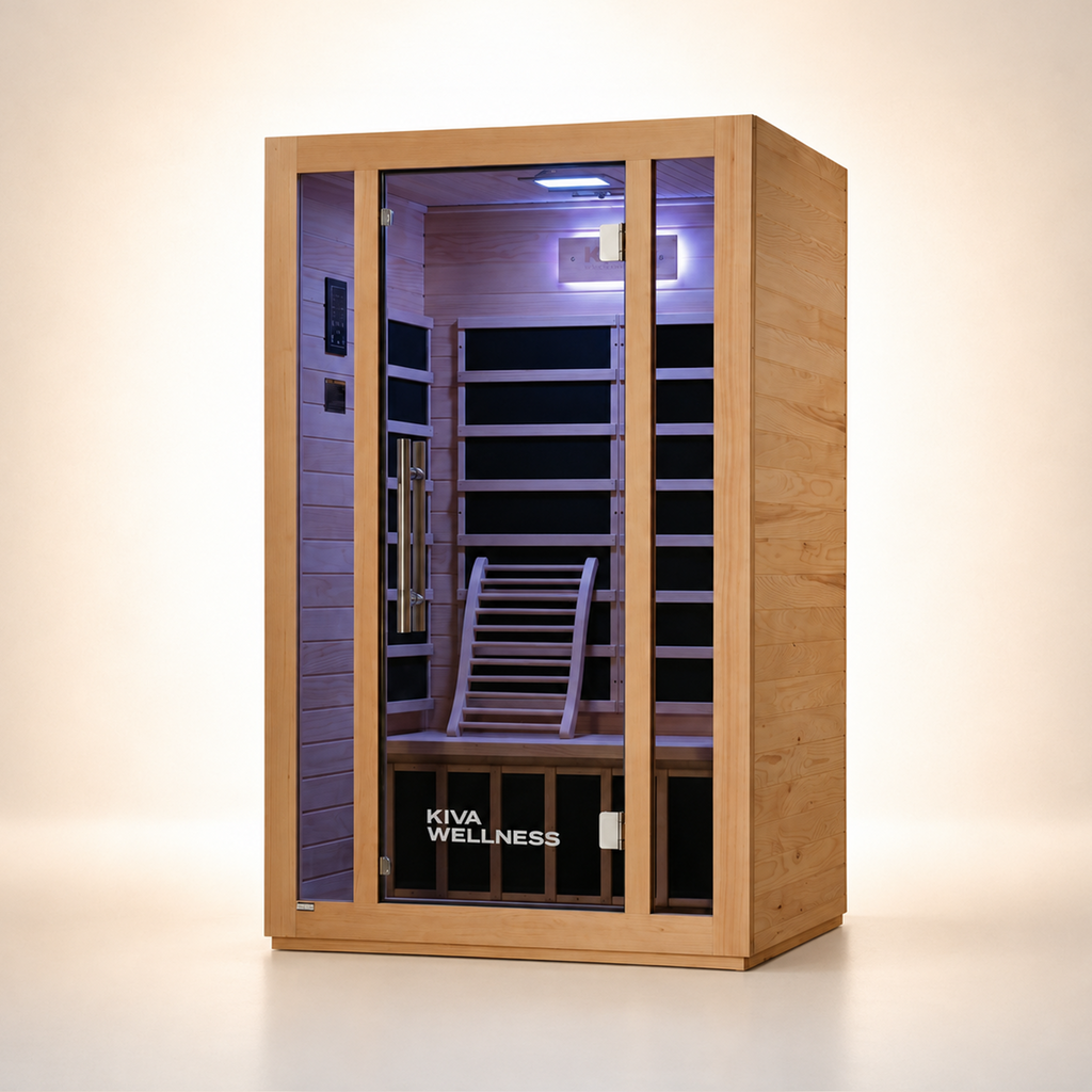 A Kiva Wellness infrared sauna with a light natural wood exterior, glass door, and a dark interior with wooden benches and a backrest, shown on a clean beige studio background.