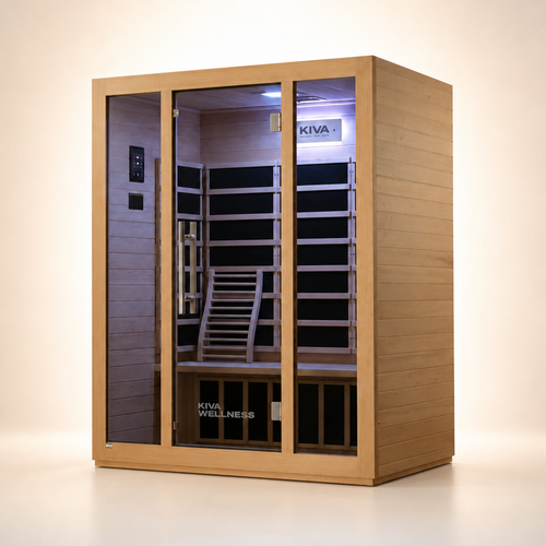 A Kiva Wellness infrared sauna room with light wood exterior, glass door, and a purple-lit interior, shown on a clean beige studio background.