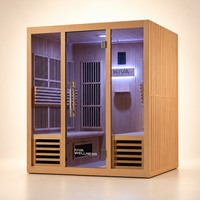 A Kiva Wellness infrared sauna with glass door, interior LED lighting, wooden benches, shown  a clean beige studio background.