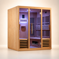 A Kiva Wellness infrared sauna with a warm light wood finish, glass door, built-in seating, and interior lighting, shown on a clean beige studio background.