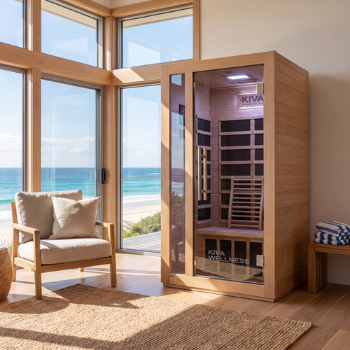 Kiva Rise 1 Person Far Infrared Sauna, set in a modern room with a large window overlooking the ocean